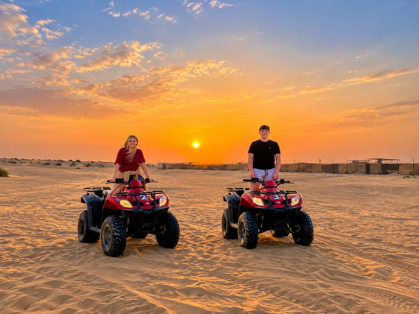 Quad biking across golden dunes in the Abu Dhabi desert